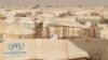 FILE - The Mbera refugee camp in southern Mauritania was set up for people fleeing violence in northern Mali and is home to more than 64,000 people, May 23, 2012. It was the unlikely site of a concert of Malian music.