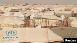 FILE - The Mbera refugee camp in southern Mauritania was set up for people fleeing violence in northern Mali and is home to more than 64,000 people, May 23, 2012. It was the unlikely site of a concert of Malian music.