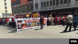 FILE - "President Robert Mugabe must go!" shouted protesters. The opposition accuses the 92-year-old leader of ruining the once vibrant economy of Zimbabwe and disregarding human rights. (S. Mhofu/VOA)