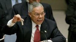 FILE - U.S. Secretary of State Colin Powell holds up a vial that he described as one that could contain anthrax, during his presentation on [Iraq] to the U.N. Security Council, in New York, Feb. 5, 2003.