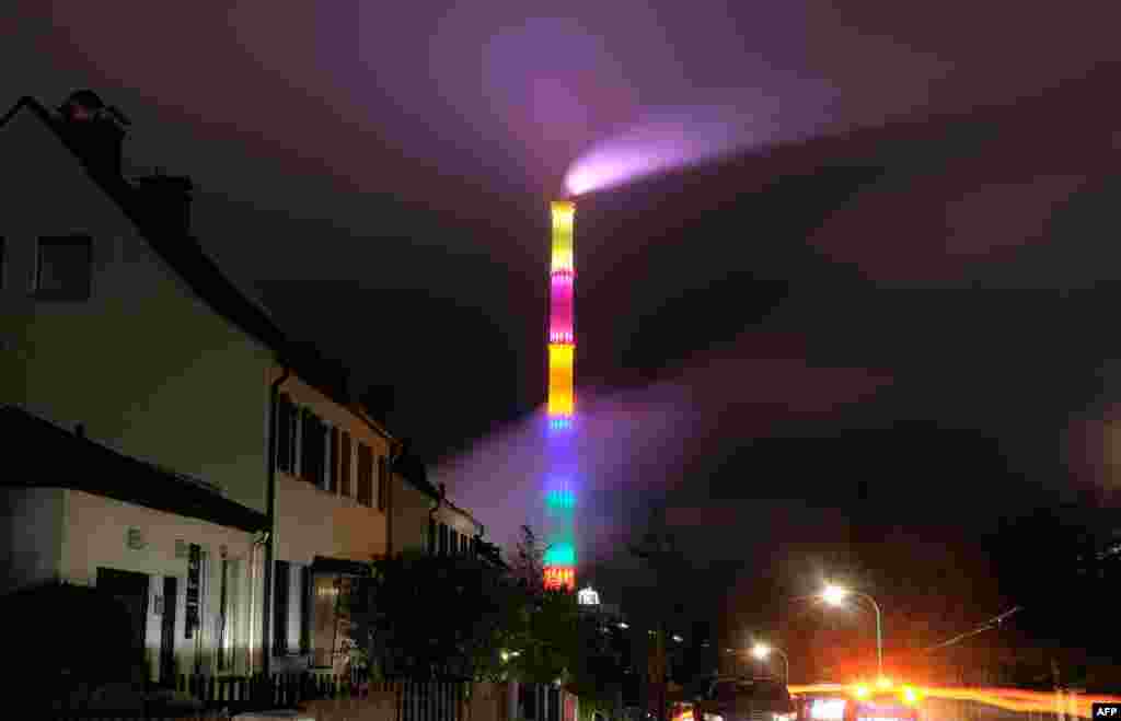 The chimney of the power plant Nord is illuminated in Chemnitz, eastern Germany.