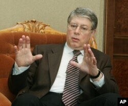 Russian official Alexey Borodavkin gestures as he speaks during an interview with the Associated Press, March 23, 2005, in Vienna.