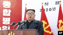 In this Tuesday, March 17, 2020, photo provided on Wednesday, March 18, 2020, by the North Korean government, North Korean leader Kim Jong Un delivers a speech during the ground-breaking ceremony of a general hospital in Pyongyang, North Korea. Kim said i