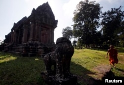 FILE - A Buddhist monk visits the Preah Vihear temple on the border between Thailand and Cambodia, Nov. 12, 2013.