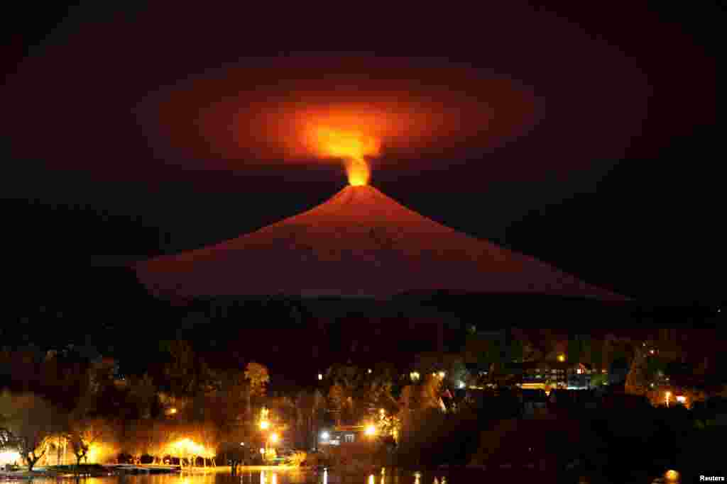 The Villarrica Volcano is seen at night from Pucon town, Chile. Villarrica, located near the popular tourist resort of Pucon, is among the most active volcanoes in South America.