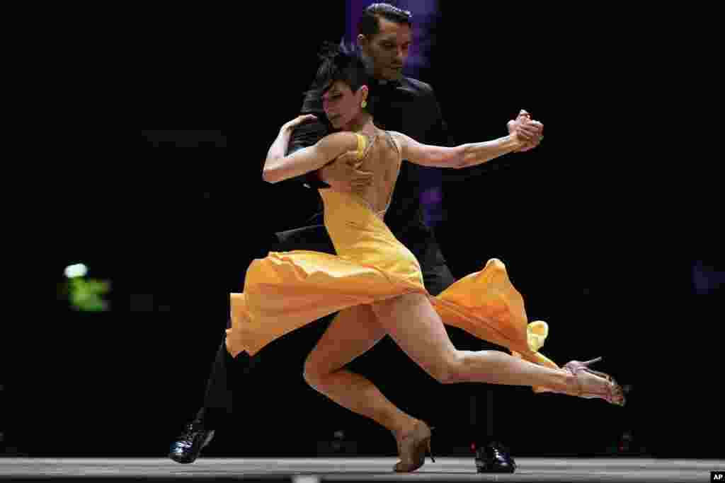 Jesus Taborda and Sabrina Amuchastegui compete in the final round of the Tango World Championship stage category, in Buenos Aires, Argentina, Sept. 25, 2021.
