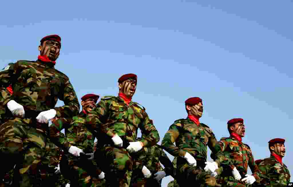 Iraqi police commandos unit march during a ceremony marking Police Day at the police academy in Baghdad.