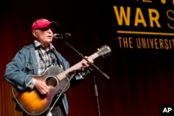 FILE - Singer-songwriter Country Joe McDonald performs at the Vietnam War Summit at the LBJ Presidential Library in Austin, Texas, April 28, 2016.