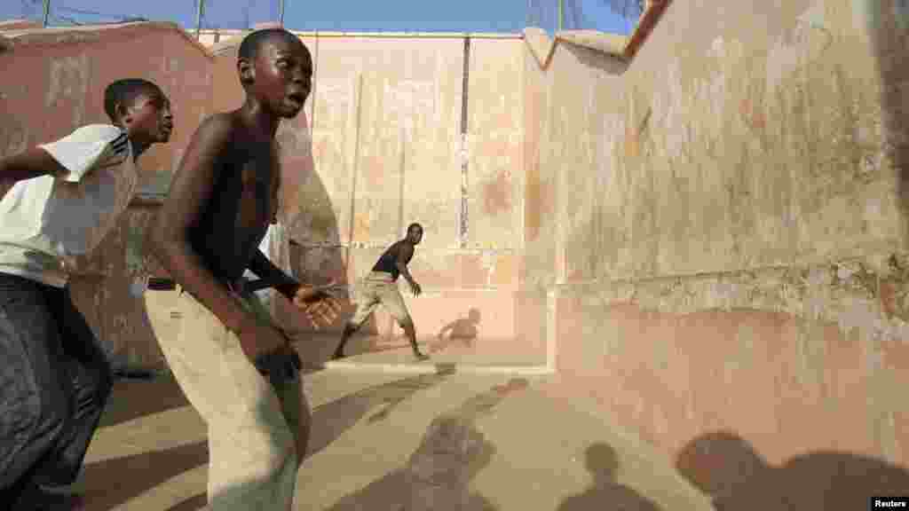 Youths play a game of Eton fives in Katsina.