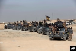 Iraq's elite counterterrorism forces gather ahead of an operation to retake the Islamic State-held city of Mosul, outside Irbil, Iraq, Oct. 15, 2016.