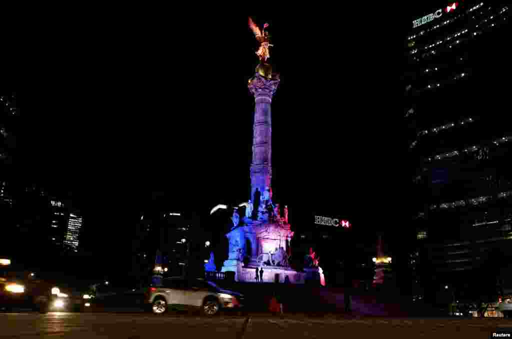 The colors of the French flag are projected on the Angel of Independence monument in Mexico City, Mexico, July 14, 2016.
