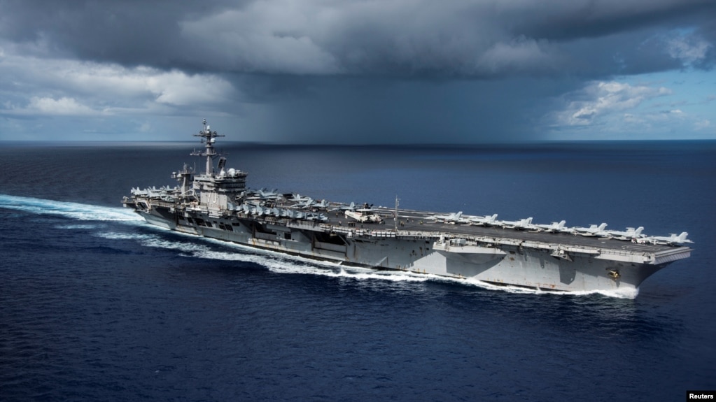 FILE - The U.S. Navy aircraft carrier USS Carl Vinson transits the Philippine Sea, April 23, 2017.