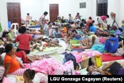 People are seen inside an evacuation center in preparation for Typhoon Mangkhut in Cagayan, Philippines, Sept. 13, 2018, photo from social media.