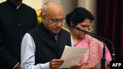 Bharatiya Janata Party (BJP) politician M.J. Akbar takes the oath during the swearing-in ceremony of new ministers, July 5, 2017, at the Presidential Palace in New Delhi. The Indian minister and veteran newspaper editor announced his resignation, Oct. 17, 2018, while still insisting that the accusations of sexual harassment are false.