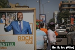 An electoral poster of candidate Roch Marc Christian Kaboré is displayed on the streets of Ouagadougou, Burkina Faso, Nov. 27, 2015.