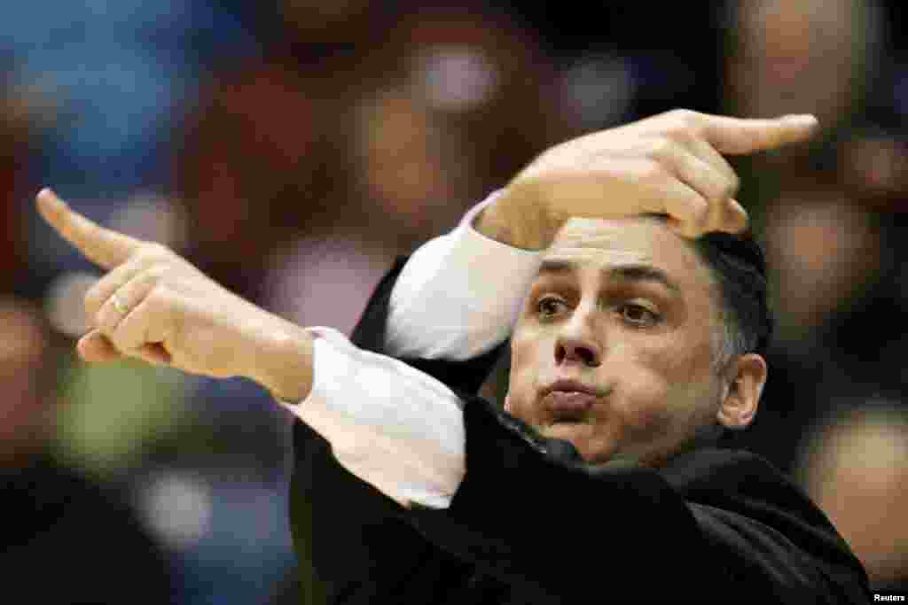 James Madison head coach Matt Brady directs his team against LIU Brooklyn during the second half of their first round NCAA tournament basketball game in Dayton, Ohio.