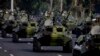 FILE - Cuban military vehicles parade along the Plaza de la Revolucion to mark the 50th anniversary of the failed Bay of Pigs invasion in Havana, April 16, 2011. 