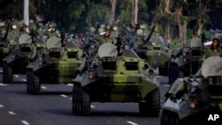 FILE - Cuban military vehicles parade along the Plaza de la Revolucion to mark the 50th anniversary of the failed Bay of Pigs invasion in Havana, April 16, 2011. Cuba on Wednesday announced the launch of five days of nationwide military exercises. 