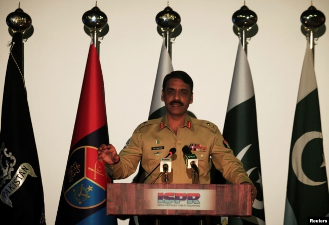 FILE - Major General Asif Ghafoor, director general of Inter-Services Public Relations (ISPR), speaks during a news conference in Rawalpindi, Pakistan, April 17, 2017.