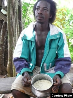 Farmer Yaw Obeng of Ghana with cooking fat made from Allanblackia seeds. (Credit: World Agro Forestry Centre/Charlie Pye-Smith)