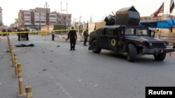 A military vehicle of Iraqi security forces is seen at the site of a suicide bomb attack in Kirkuk, Iraq, Nov. 5, 2017. 