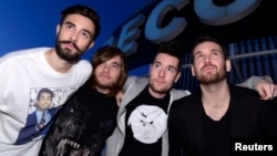 (From L to R) Members of the British electro-pop band Bastille, Kyle Simmons, Chris 'Woody' Wood, Dan Smith and Will Farquarson, pose for pictures at Capitol Studios in Los Angeles, Dec. 5, 2013.
