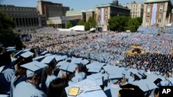 In this Wednesday, May 17, 2017, file photo, graduating students fill the Columbia University campus during a graduation ceremony in New York. (AP Photo/Seth Wenig, File)