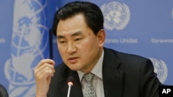 An Myong Hun, a North Korean official reacts to questions about the cyber-attack on Sony Pictures at United Nations headquarters on Jan. 13, 2015. (AP Photo/Frank Franklin II)