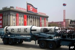 FILE - A submarine missile is paraded across Kim Il Sung Square during a military parade in Pyongyang, North Korea, April 15, 2017.