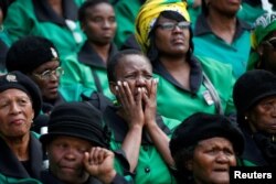 Mourners attend a memorial service for Winnie Madikizela-Mandela at Orlando Stadium in Johannesburg's Soweto township, South Africa, April 11, 2018.