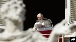 Pope Benedict XVI delivers his message from his studio window overlooking St. Peter's Square at the Vatican, March 6, 2011