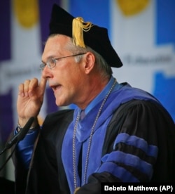 Dr. Vincent Boudreau, interim president for City College of New York (CCNY), speaks to graduates during a graduation ceremony for the division of Humanities and the Arts, Wednesday May 31, 2017, in New York.