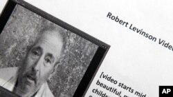 This copy photograph of a paper printout obtained by The Associated Press shows Robert Levinson. Long after he vanished in Iran, the retired FBI agent reappeared in a video and a series of photographs sent to his family over the past year, transforming a 