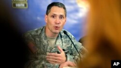 Col. Bradley Poppen answers a question during a news conference regarding Sgt. Bowe Bergdahl and the reintegration process, in San Antonio, Texas, June 13, 2014.