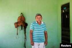 Jose Olivo, 46, who was formerly employed on the construction of the Transnordestina railway, poses for a photograph at his home in Missao Velha, Ceara state, Brazil, Oct. 25, 2016.