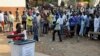 FILE - A man casts his vote at a polling station during a presidential election in Accra, Ghana, Dec. 7, 2012. 