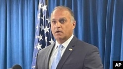 FILE - Acting U.S. Attorney Vipal Patel speaks in Cincinnati, July 22, 2021. Patel said on Nov. 5, 2021, that Yanjun Xu, convicted in an espionage case, had been accused of trying to steal technology related to GE Aviation's composite aircraft engine fan to benefit China.