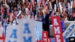 Former President Bill Clinton takes the stage to speak during the second day of the Democratic National Convention in Philadelphia , Tuesday, July 26, 2016. (AP Photo/Paul Sancya)