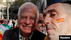 FILE - Spanish politician Josep Borrell takes part in a pro-unity demonstration in central Barcelona, Spain, Oct. 29, 2017. 