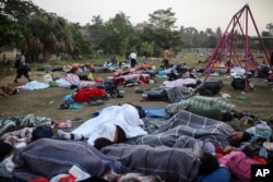 Dozens of Central American migrants, traveling with the annual "Stations of the Cross" caravan, sleep at a sports club in Matias Romero, Oaxaca State, Mexico, April 3, 2018.