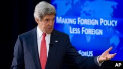 Secretary of State John Kerry speaks about foreign policy, including the situation in Ukraine, during a town hall meeting with university students, Tuesday, March 18, 2014, at the State Department in Washington.