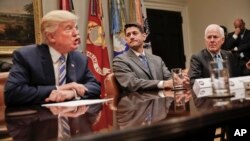 House Speaker Paul Ryan of Wis., center, and Senate Majority Whip John Cornyn, R-Texas, right, listen to President Donald Trump, left, speak during Trump's meeting with House and Senate Leadership in the Roosevelt Room of the White House in Washington, June 6, 2017.
