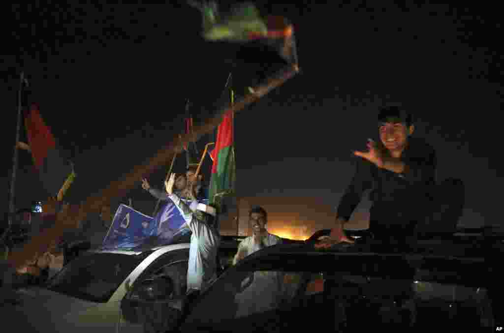 Supporters of Ashraf Ghani Ahmadzai celebrate his win on the street in Kabul, Afghanistan, Sept. 21, 2014.