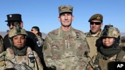 U.S. Army General John Nicholson, commander of Resolute Support forces and U.S. forces in Afghanistan, poses for photograph after an exercise in the Mohammad Agha district of Logar province, eastern of Kabul, Afghanistan, Thursday, Nov. 30, 2017.