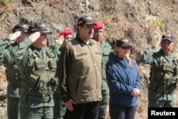 Venezuela's President Nicolas Maduro attends a military exercise in in Caracas, Feb. 1, 2019.