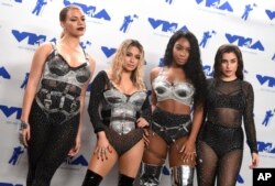 Dinah Jane, from left, Ally Brooke, Normani Kordei, and Lauren Jauregui of Fifth Harmony, winners of the award for best pop video for "Down," pose in the press room at the MTV Video Music Awards.