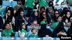 FILE - Saudi Arabian women attend a rally celebrating National Day, in Riyadh, Saudi Arabia, Sept. 23, 2017.