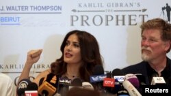 Movie star Salma Hayek speaks during a news conference to promote her film "The Prophet" as writer and director Roger Allers (R) looks on, in Beirut, Lebanon, April 27, 2015