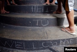 FILE - "Welcome to Hell" is written on the stairs inside Quezon City Jail in Manila, Philippines Oct. 19, 2016.