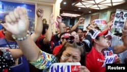 Supporters of Pheu Thai Party react after unofficial results, during the general election in Bangkok, Thailand, March 24, 2019.